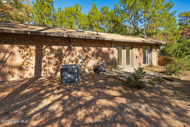 rear view of property with a patio and french doors