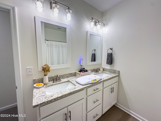 bathroom featuring vanity and hardwood / wood-style flooring