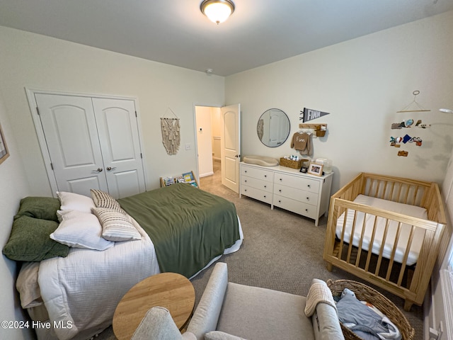 bedroom featuring a closet and carpet flooring