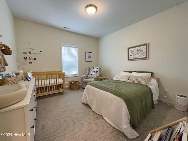 carpeted bedroom featuring sink