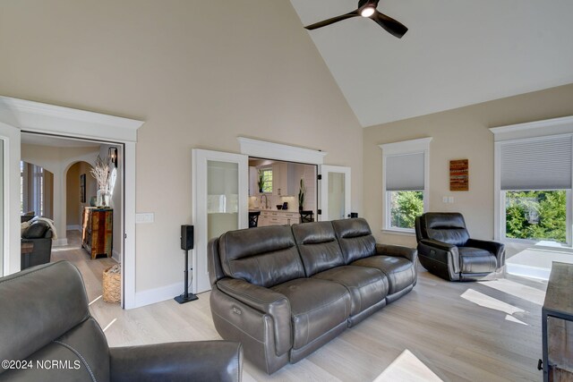 kitchen featuring white cabinetry, stainless steel appliances, sink, and light stone counters