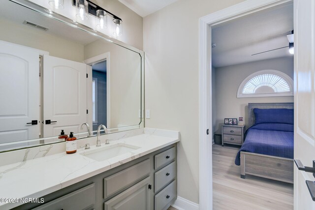 bathroom with crown molding, a bath, and hardwood / wood-style floors