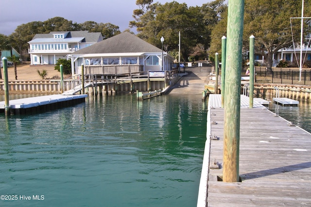 dock area with a water view and a gazebo