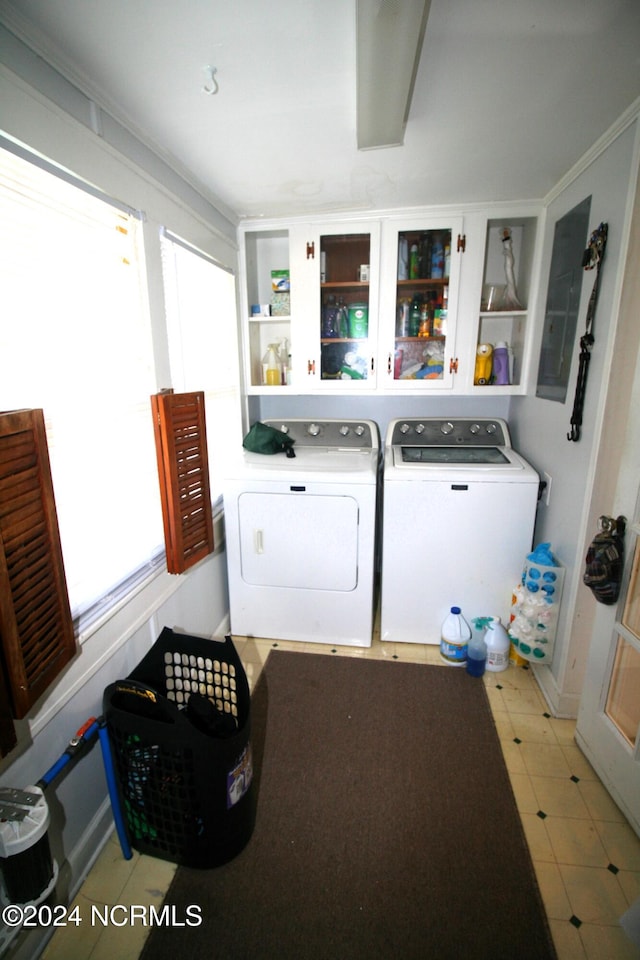 laundry room with ornamental molding and separate washer and dryer