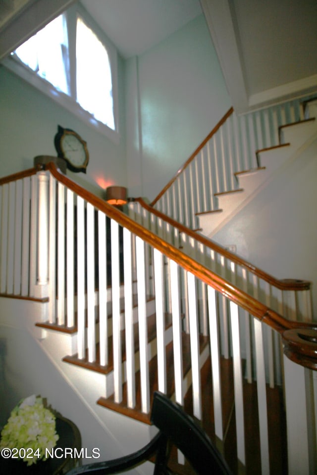 stairway with beam ceiling