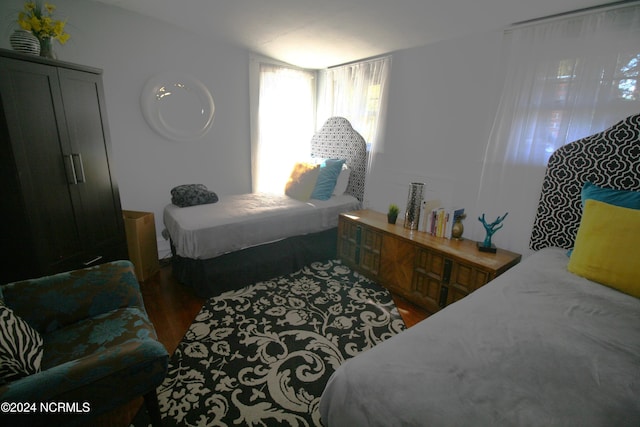 bedroom featuring dark wood-type flooring