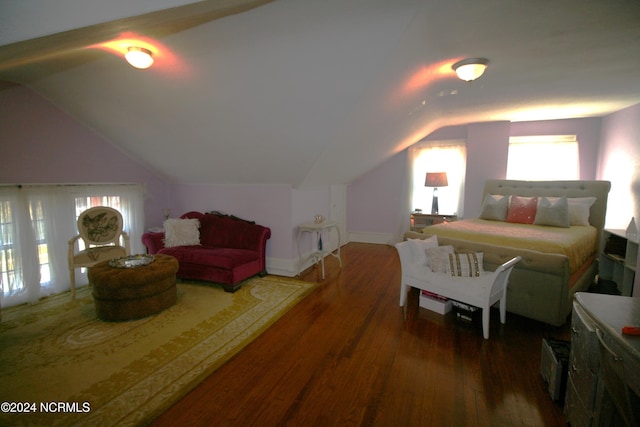 bedroom featuring lofted ceiling and dark hardwood / wood-style floors