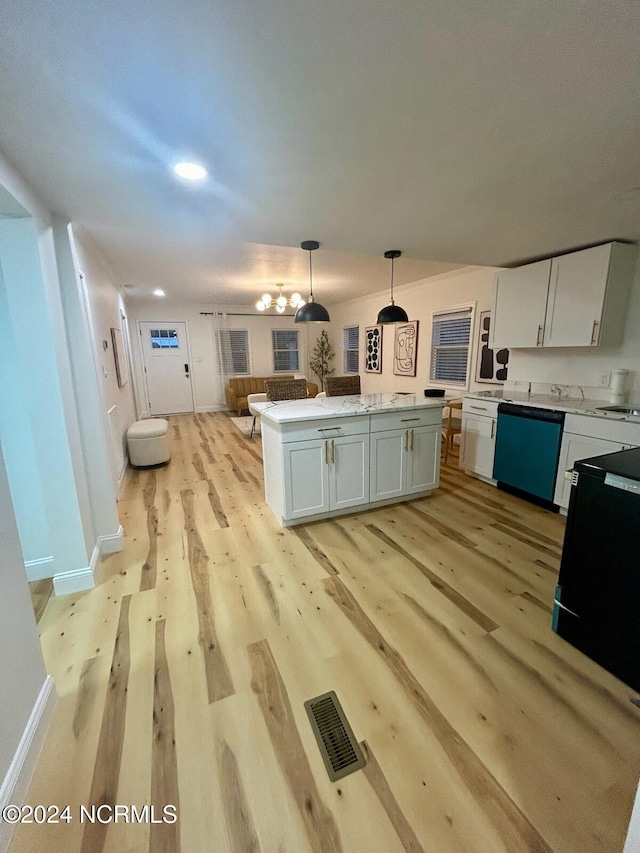 kitchen with black dishwasher, white cabinetry, light hardwood / wood-style flooring, and decorative light fixtures