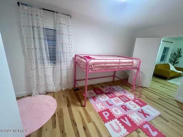 bedroom with wood-type flooring