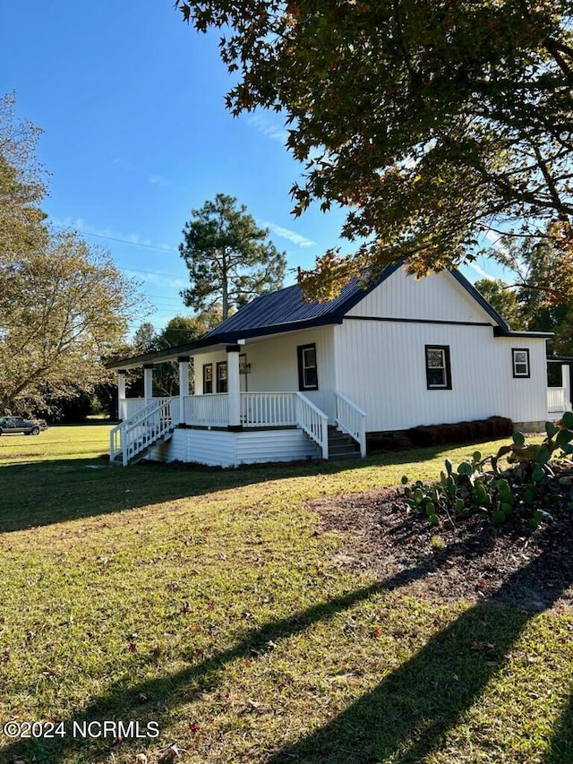 exterior space featuring a porch and a front lawn