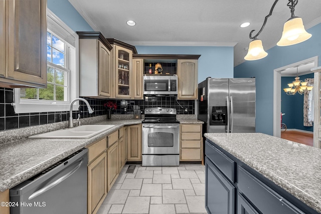 kitchen with appliances with stainless steel finishes, tasteful backsplash, crown molding, sink, and decorative light fixtures