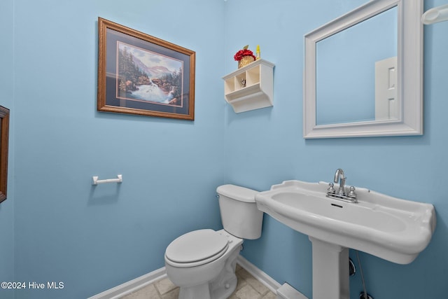 bathroom with sink and toilet