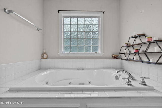 bathroom featuring tiled bath