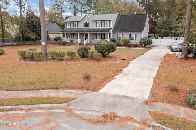 view of front of property with a porch and a front yard