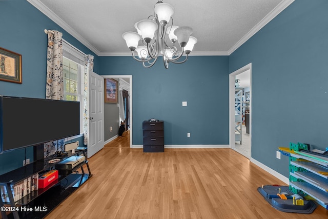 office area featuring a notable chandelier, wood-type flooring, and crown molding