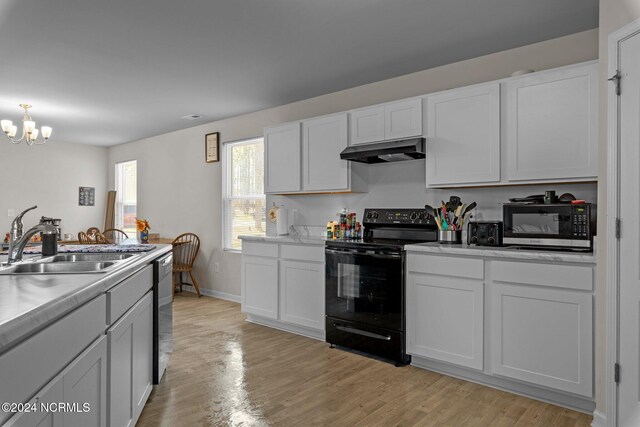 kitchen with white cabinetry, light hardwood / wood-style flooring, dishwasher, black electric range, and sink