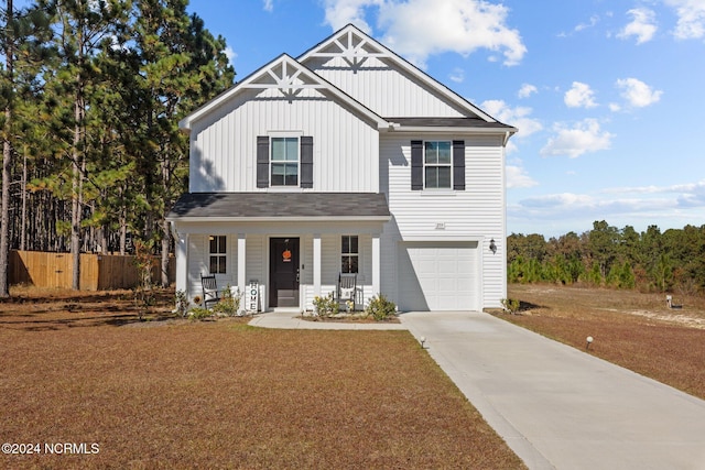 view of front of property with covered porch and a garage