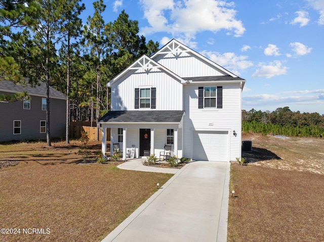 view of front facade with a garage and a porch