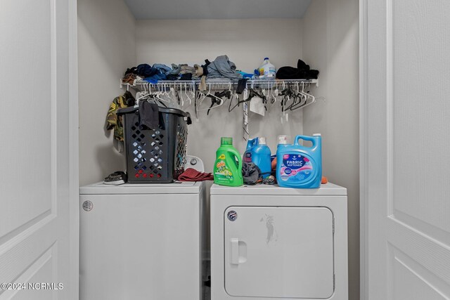 laundry room featuring washing machine and clothes dryer