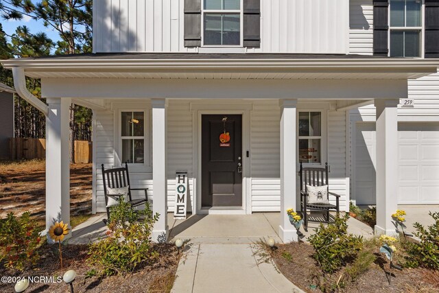 doorway to property with a porch