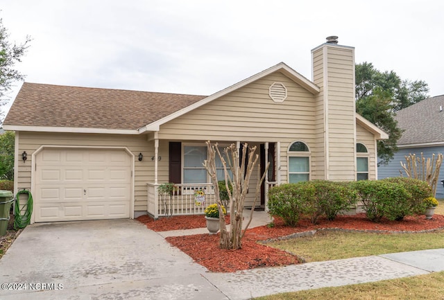 view of front of property featuring a garage and covered porch