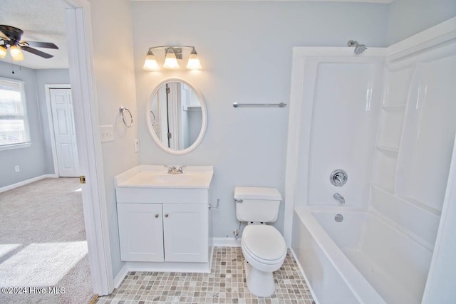 full bathroom with ceiling fan, vanity, tub / shower combination, and toilet