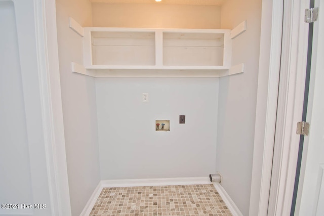 laundry area featuring electric dryer hookup, tile patterned floors, and washer hookup