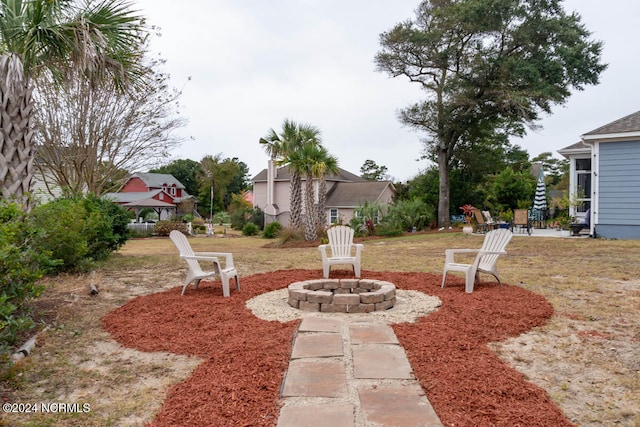 view of yard with a fire pit and a patio