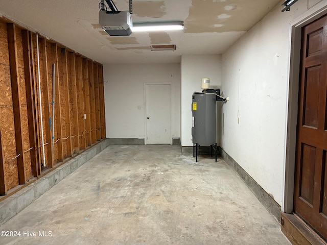 garage with a garage door opener and water heater