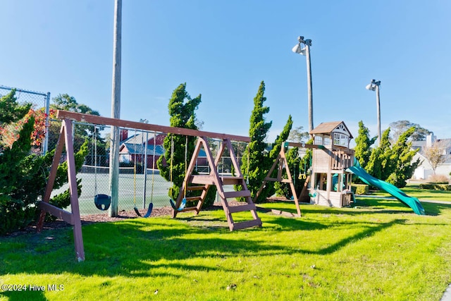 view of playground with a yard