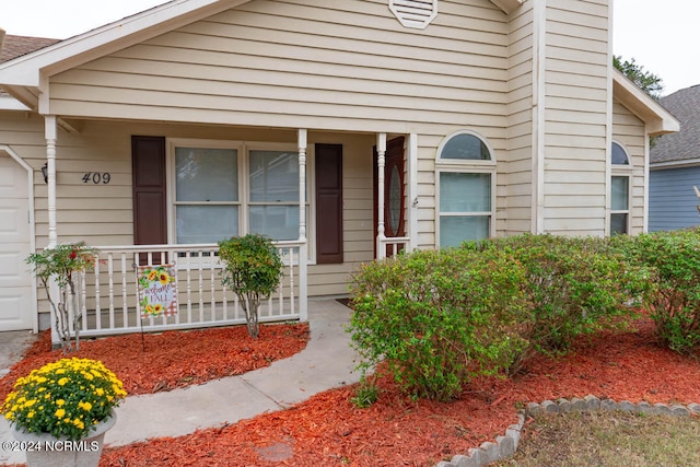 entrance to property with covered porch