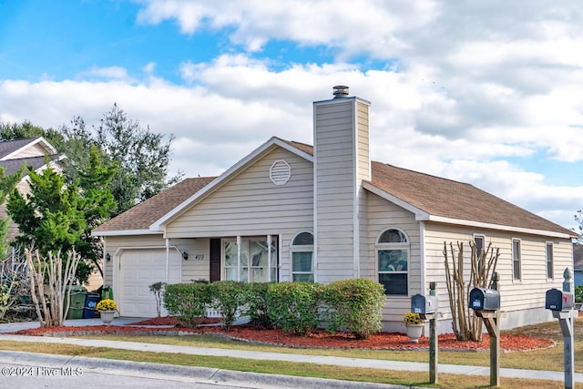 view of front of property with a garage