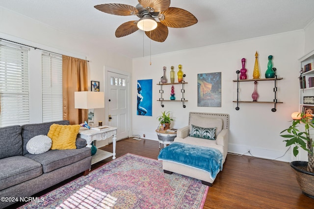 living room with dark hardwood / wood-style floors and ceiling fan