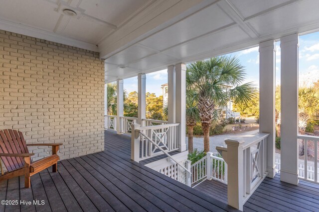 wooden terrace with a porch