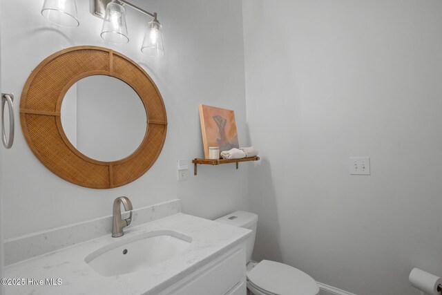 bedroom featuring multiple windows, wood-type flooring, a tray ceiling, and ceiling fan