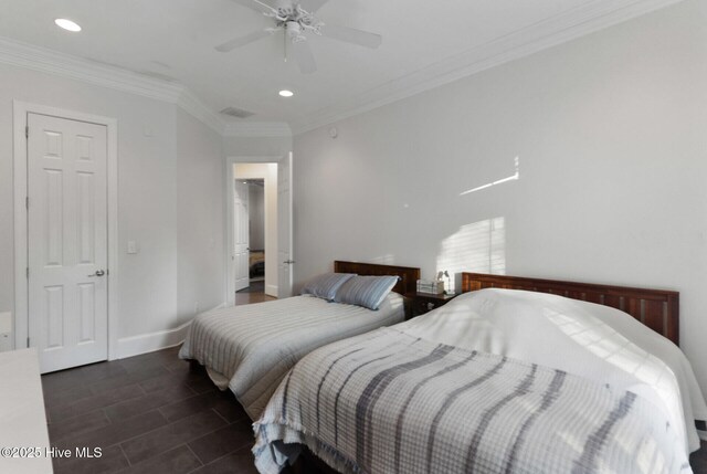 bedroom with dark tile patterned floors, ceiling fan, and crown molding