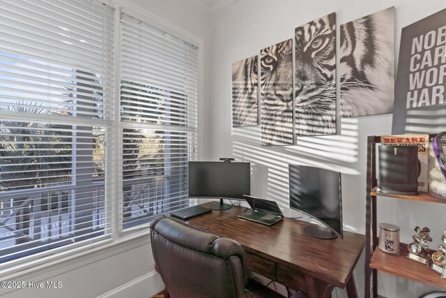 tiled living room with beverage cooler, ceiling fan, a healthy amount of sunlight, and sink