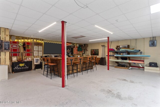 bar featuring a paneled ceiling