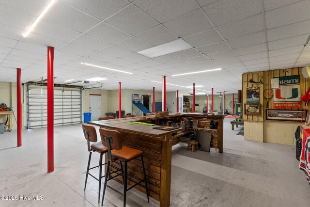 basement featuring a paneled ceiling