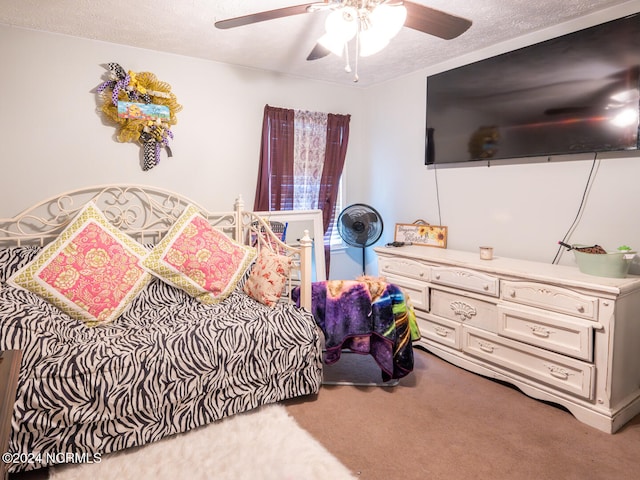 bedroom with light carpet, a textured ceiling, and ceiling fan