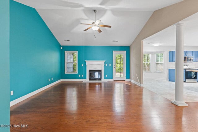 8525 Primm Forest Dr, Leland, NC 28451 - unfurnished living room with wood finished floors, a ceiling fan, decorative columns, visible vents, and baseboards