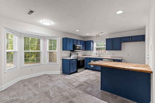 8525 Primm Forest Dr, Leland, NC 28451 - kitchen with a sink, blue cabinets, visible vents, and dishwasher