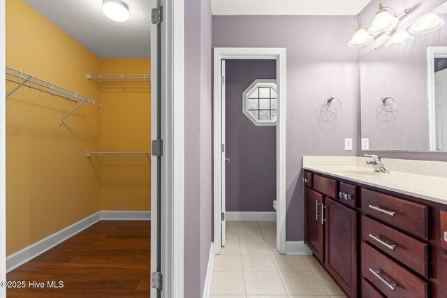 8525 Primm Forest Dr, Leland, NC 28451 - spare room featuring a textured ceiling, baseboards, ceiling fan, visible vents, and wood finished floors