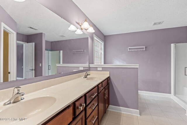 8525 Primm Forest Dr, Leland, NC 28451 - full bathroom featuring a stall shower, baseboards, a textured ceiling, and wood finished floors