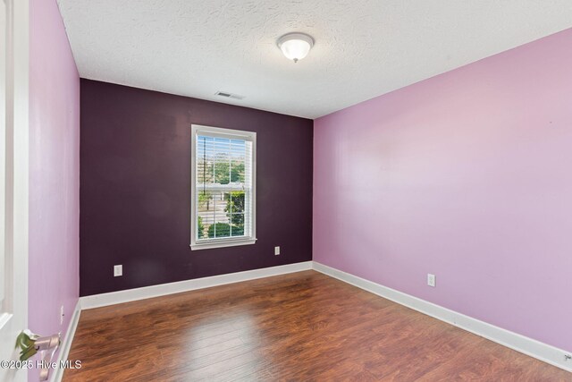 8525 Primm Forest Dr, Leland, NC 28451 - bathroom featuring toilet, vanity, tile patterned floors, shower / bath combination, and a textured ceiling