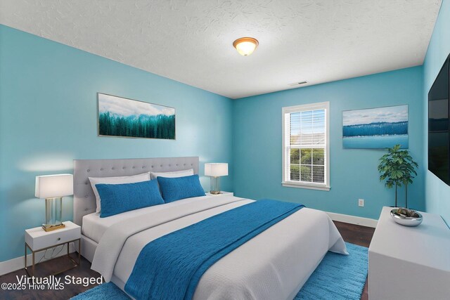8525 Primm Forest Dr, Leland, NC 28451 - spare room with baseboards, dark wood-style flooring, visible vents, and a textured ceiling