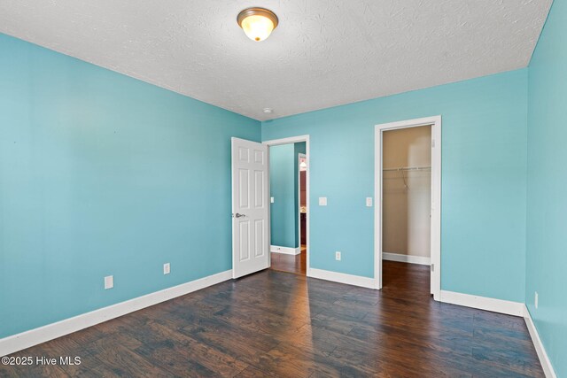 8525 Primm Forest Dr, Leland, NC 28451 - bedroom featuring a textured ceiling, visible vents, wood finished floors, and baseboards