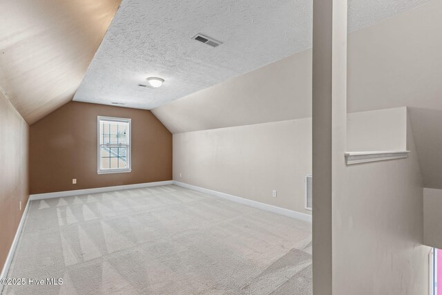 8525 Primm Forest Dr, Leland, NC 28451 - unfurnished bedroom featuring a closet, a textured ceiling, baseboards, wood finished floors, and a spacious closet