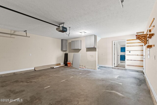 8525 Primm Forest Dr, Leland, NC 28451 - garage featuring a garage door opener and baseboards