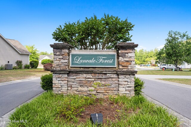 8525 Primm Forest Dr, Leland, NC 28451 - traditional-style house featuring concrete driveway, a garage, and a front lawn